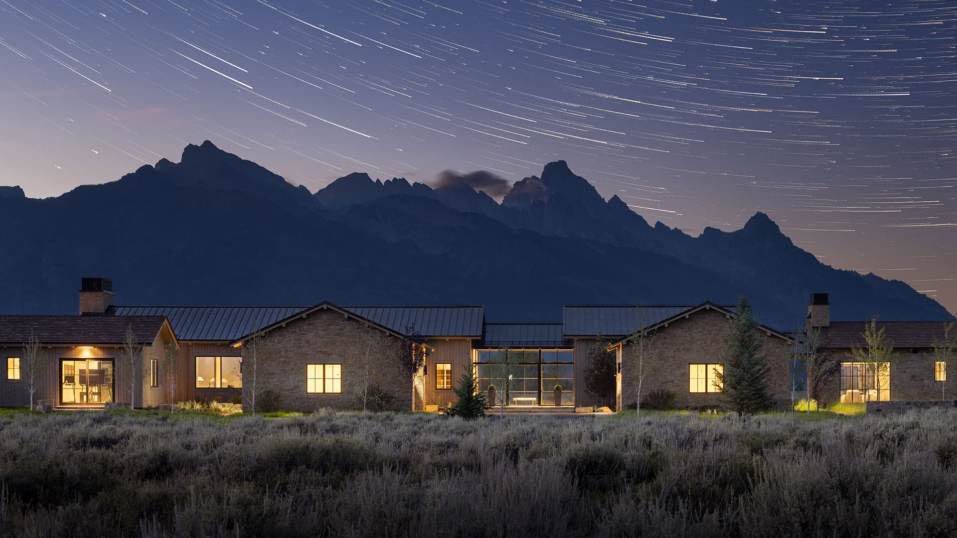 startrails over the Tetons with the Starfall home featuring Nida Risto Interior Design.